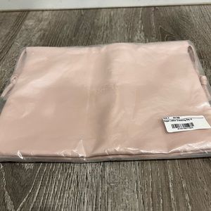 Rose Inc vegan leather drawstring bag.